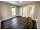 The bedroom features neutral walls, brown flooring, two doors, and a window at 638 W 30Th St, Indianapolis, IN 46208