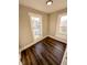 Cozy bedroom with wood floors, natural light and freshly painted walls create a serene atmosphere at 638 W 30Th St, Indianapolis, IN 46208