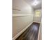 This closet features a light beige paint job, brown flooring, and one window at 638 W 30Th St, Indianapolis, IN 46208