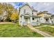 Front of the house with a cozy porch, lawn, and mature trees at 638 W 30Th St, Indianapolis, IN 46208