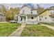 Charming two-story home with a covered front porch and well-maintained lawn and walkway at 638 W 30Th St, Indianapolis, IN 46208
