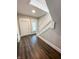 Bright foyer with hardwood floors, a window, and a view of the stairs at 638 W 30Th St, Indianapolis, IN 46208