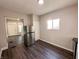 Spacious kitchen with wood flooring, neutral walls, and stainless steel refrigerator, offering a practical layout at 638 W 30Th St, Indianapolis, IN 46208