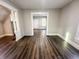 Open-concept living room with hardwood floors, neutral paint, and bright, natural light at 638 W 30Th St, Indianapolis, IN 46208