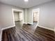 Living room with wood floors and neutral walls, showing open doorways to the kitchen and the home's entry at 638 W 30Th St, Indianapolis, IN 46208