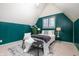 Attic bedroom features stylish accents, a comfortable bed, and a unique cozy atmosphere at 671 State Road 267, Mooresville, IN 46158
