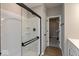 Bathroom with a large shower with glass doors, neutral walls, and wooden flooring at 7367 Broadview Ln, McCordsville, IN 46055