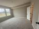 Bright bedroom featuring a large window and soft carpet, creating a cozy atmosphere at 7367 Broadview Ln, McCordsville, IN 46055