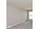 This bedroom is well-lit by a window, and has neutral walls and soft gray carpet at 7367 Broadview Ln, McCordsville, IN 46055
