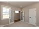 Cozy bedroom with neutral carpet, glass door closet, and a bright window overlooking the outside at 7367 Broadview Ln, McCordsville, IN 46055