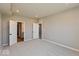 View of a neutral-toned bedroom, featuring two white doors, neutral walls, and plush carpeting at 7367 Broadview Ln, McCordsville, IN 46055