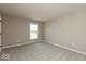This cozy bedroom boasts a large window, neutral walls and plush, light gray carpeting at 7367 Broadview Ln, McCordsville, IN 46055