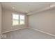 Bright bedroom featuring neutral carpet, window, and ample natural light at 7367 Broadview Ln, McCordsville, IN 46055