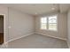 Carpeted bedroom featuring a large window that brings in an abundance of natural light at 7367 Broadview Ln, McCordsville, IN 46055