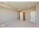 A carpeted bedroom showcasing neutral walls, two doors, and recessed lighting at 7367 Broadview Ln, McCordsville, IN 46055