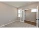 Comfortable bedroom boasting neutral carpet, double doors, and a window for natural light at 7367 Broadview Ln, McCordsville, IN 46055