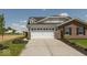 Stylish two-story home featuring a brick exterior, a two-car garage, and a well-maintained lawn at 7367 Broadview Ln, McCordsville, IN 46055