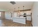 Spacious kitchen with white cabinets, stainless steel appliances, a large island, and stylish pendant lighting at 7367 Broadview Ln, McCordsville, IN 46055