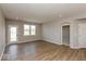 Open living room with hardwood floors, recessed lights, and an arched doorway for seamless flow at 7367 Broadview Ln, McCordsville, IN 46055