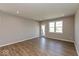 Bright living room featuring hardwood floors, recessed lighting, a glass panel back door, and window at 7367 Broadview Ln, McCordsville, IN 46055