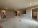 Spacious living room featuring plush carpeting and recessed lighting, perfect for relaxation at 7367 Broadview Ln, McCordsville, IN 46055