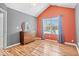 Bedroom featuring vaulted ceiling, window, hardwood flooring and modern dresser at 7415 Chapel Villas Dr # D, Indianapolis, IN 46214