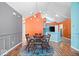 The dining room features hardwood floors, stylish light fixture, and open access to kitchen at 7415 Chapel Villas Dr # D, Indianapolis, IN 46214