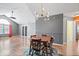 Bright dining room featuring vaulted ceilings, stylish lighting and hardwood flooring throughout at 7415 Chapel Villas Dr # D, Indianapolis, IN 46214