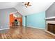 Open floor plan of living room and kitchen, fireplace, and hardwood flooring at 7415 Chapel Villas Dr # D, Indianapolis, IN 46214