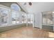 Inviting sunroom with many windows, door to the outside, and wood-look floors, perfect for relaxation at 7415 Chapel Villas Dr # D, Indianapolis, IN 46214