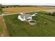 Aerial view of a home with a pool, a shed, and well-maintained green space at 8225 W 825 N, Thorntown, IN 46071