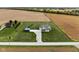 Sprawling property featuring manicured lawns, outbuilding and surrounded by agricultural land at 8225 W 825 N, Thorntown, IN 46071