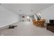 Spacious finished basement featuring a dining table, kitchenette, and stairs to the main level at 8225 W 825 N, Thorntown, IN 46071