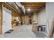 Unfinished basement with exposed ceiling, door, and boxes at 8225 W 825 N, Thorntown, IN 46071