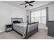 A well-lit bedroom featuring a modern bed frame and neutral decor at 8225 W 825 N, Thorntown, IN 46071