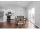 Bright dining area boasts wood floors, modern lighting, and sliding door access to the deck at 8225 W 825 N, Thorntown, IN 46071