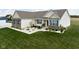 Aerial view of the home features a brick and vinyl exterior, a manicured lawn, and landscaping at 8225 W 825 N, Thorntown, IN 46071