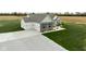 Lovely two-story home featuring an attached two-car garage and well-kept lawn and driveway at 8225 W 825 N, Thorntown, IN 46071