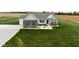 Charming home with a landscaped yard, brick accents, and a well-maintained lawn at 8225 W 825 N, Thorntown, IN 46071