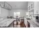 Well-lit kitchen showcases granite countertops, stainless steel appliances, and an adjacent dining space at 8225 W 825 N, Thorntown, IN 46071