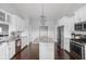 Modern kitchen featuring white cabinets, stainless steel appliances, granite countertops, and an island at 8225 W 825 N, Thorntown, IN 46071