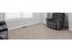 Relaxing living room featuring a comfortable recliner and neutral carpet at 8225 W 825 N, Thorntown, IN 46071