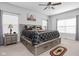 Cozy main bedroom with a ceiling fan, ample natural light, and neutral decor for relaxation at 8225 W 825 N, Thorntown, IN 46071