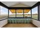 The porch has barstool seating and a view of an expansive field at 8225 W 825 N, Thorntown, IN 46071