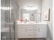 Beautiful bathroom featuring a dual vanity, large mirror, and a glass enclosed shower at 8660 Hudson Way, Brownsburg, IN 46112