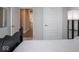Cozy bedroom featuring a view of the hallway and a bright window with blinds at 8660 Hudson Way, Brownsburg, IN 46112