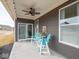 Charming covered patio featuring a ceiling fan and outdoor seating, perfect for relaxing and entertaining at 8660 Hudson Way, Brownsburg, IN 46112