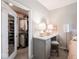 Charming dressing area features vanity with mirror and open walk in closet for your wardrobe at 8660 Hudson Way, Brownsburg, IN 46112