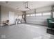 Spacious garage with epoxy floors, storage and double doors for vehicle access at 8660 Hudson Way, Brownsburg, IN 46112