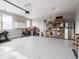 Spacious garage with epoxy floors, storage cabinets, and ample room for parking at 8660 Hudson Way, Brownsburg, IN 46112